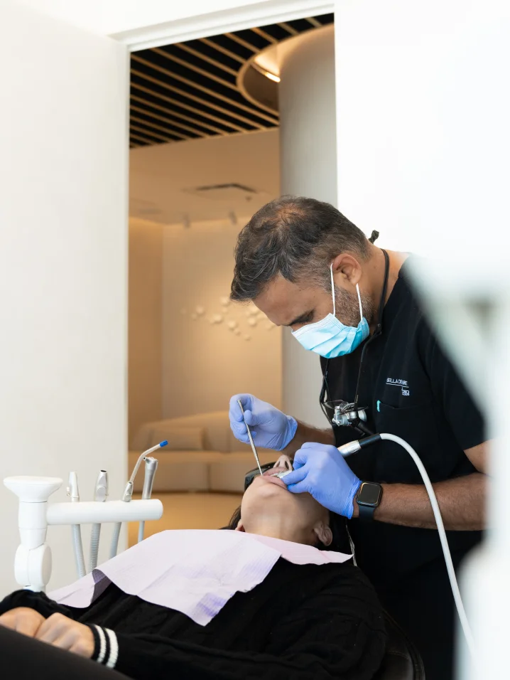 Dr Nilesh Amin working on a patient